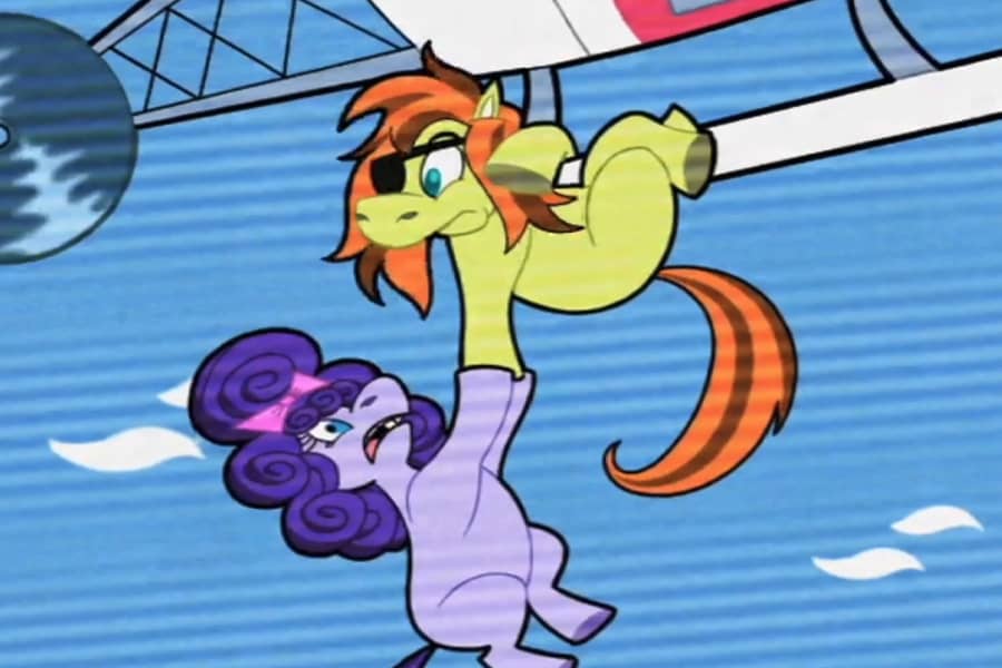 Guillermo, a pony with an eyepatch, holds Roxannes hoof as they dange from a helicopter