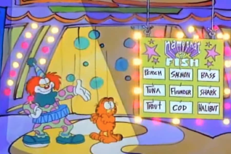 Binky with a contestant, Garfield the cat, next to a board with different fish names on it