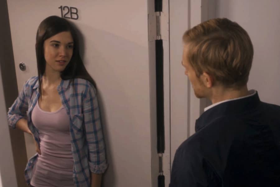teen girl answering the door for an older man