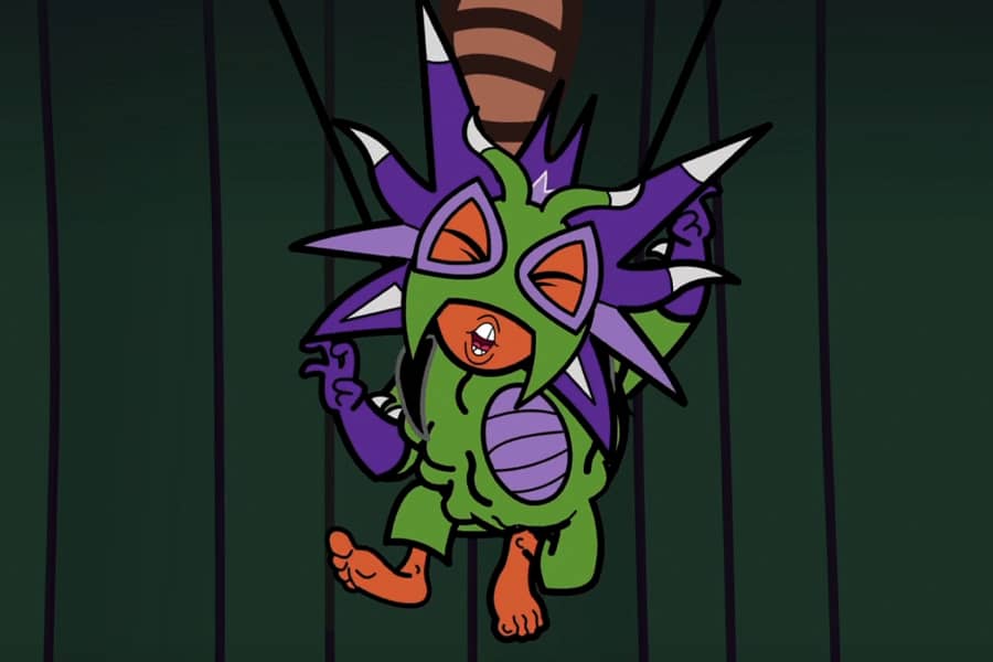 contestant being held up by wires, in pain, as something is being injected into his costume