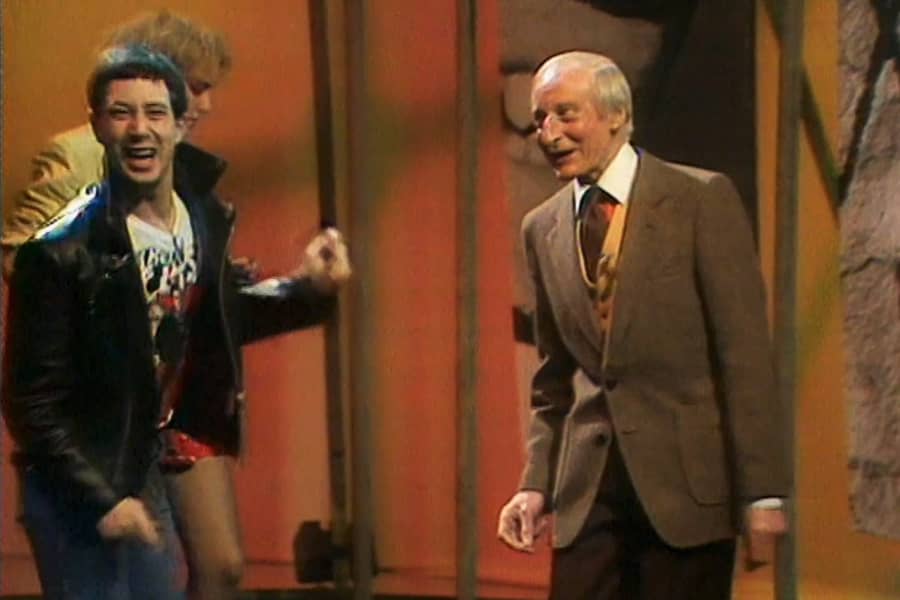 Baz dancing with an older gentleman