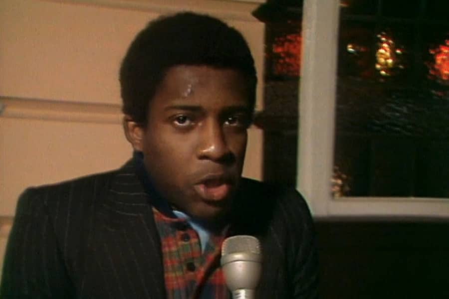 a young Black man giving an interview
