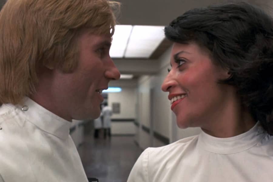 Nurse Cleo and Dr. Boyd smile at each other