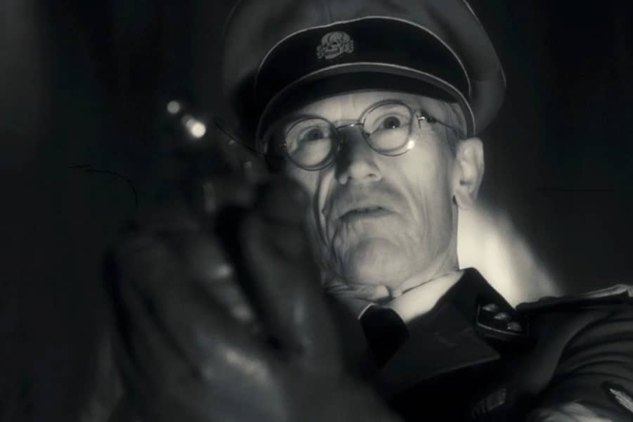 closeup of Nazi pointing his gun