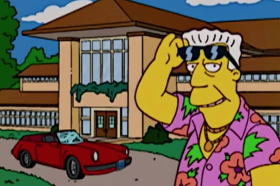 Kent Brockman in front of a nice house and sports car