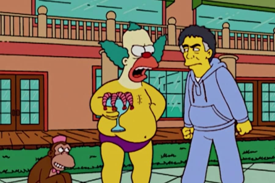 Krusty the Clown in a Speedo by the pool eating shrimp cocktail and yelling at a guy in a sweatsuit next to a monkey