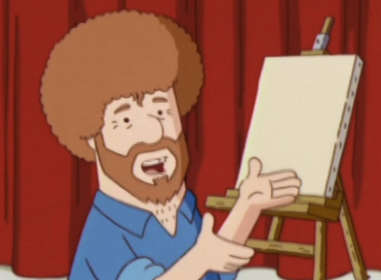 Rusty Shanks, a curly haired man, in front of a canvas and easel