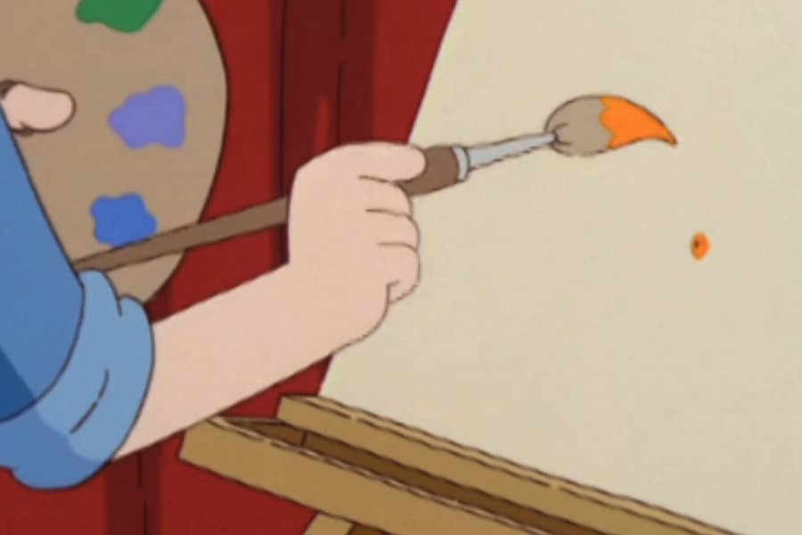 Rusty dabs some orange on a canvas with a paintbrush