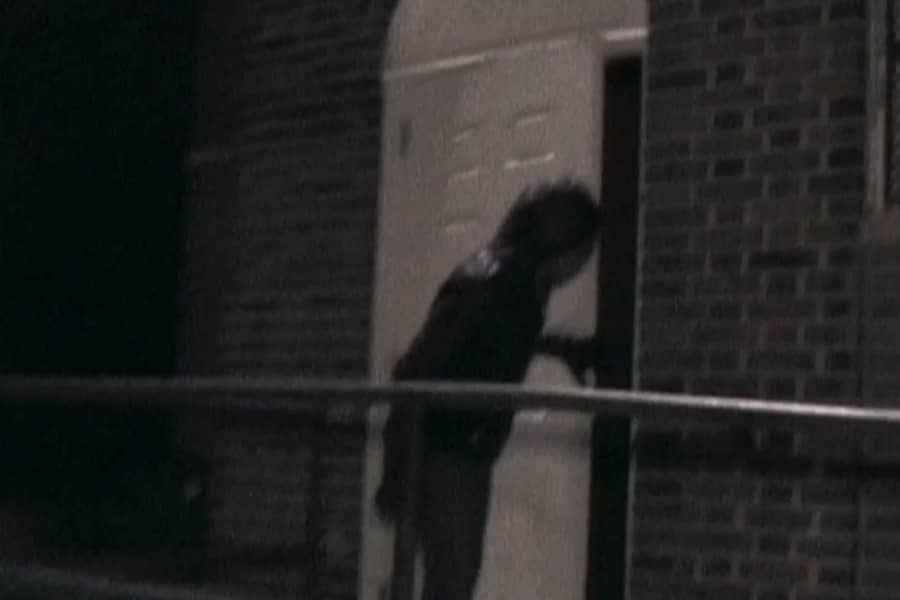 figure opens a door