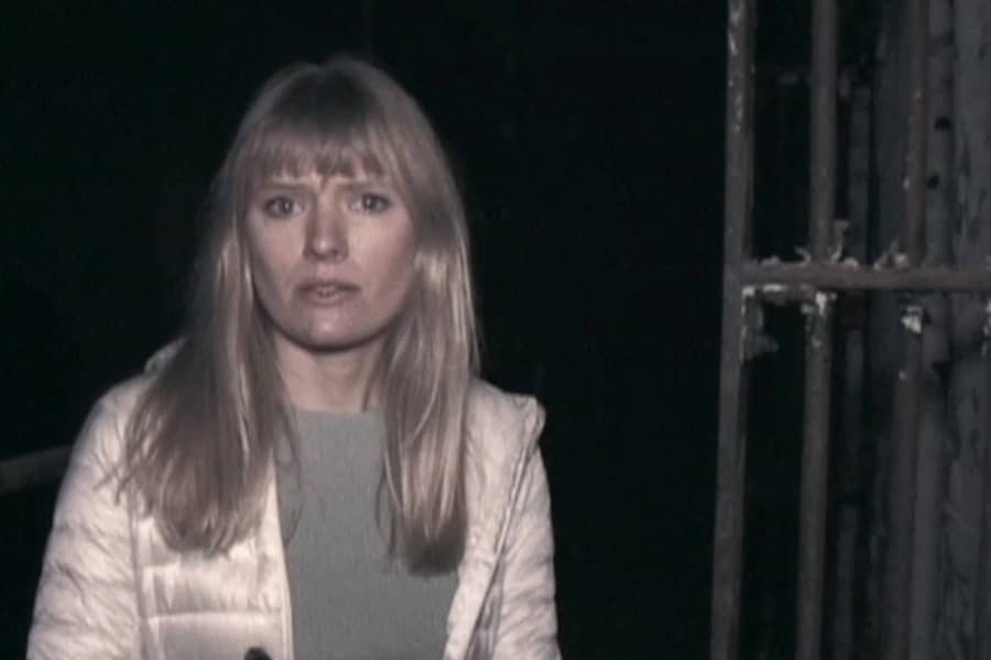Riley looking spooked in an abandoned jail
