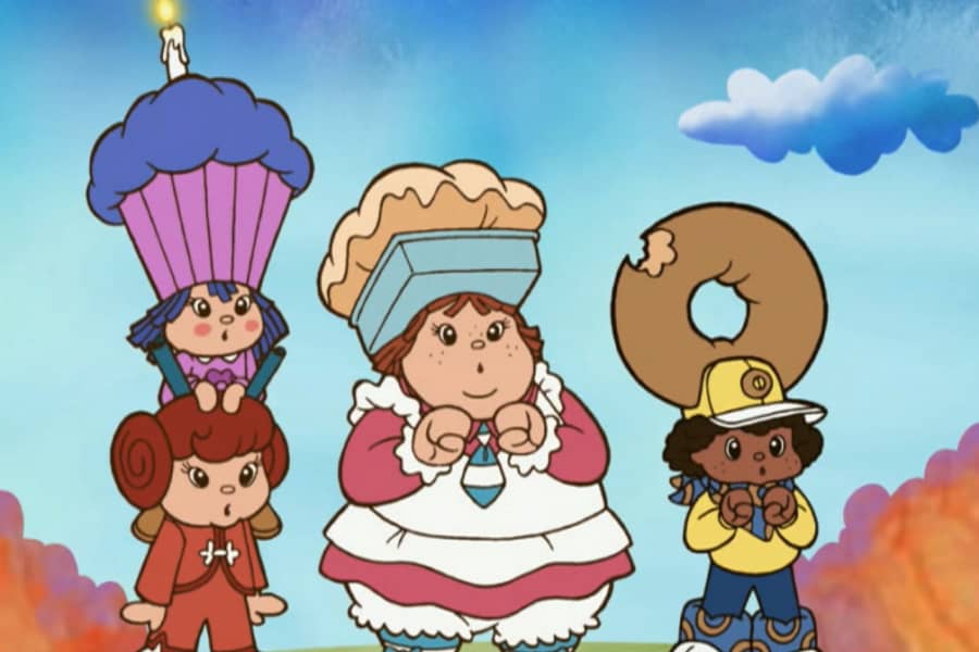 Paula, Donnie, and two others: a cupcake hatted girl and a cinnamon roll hair girl
