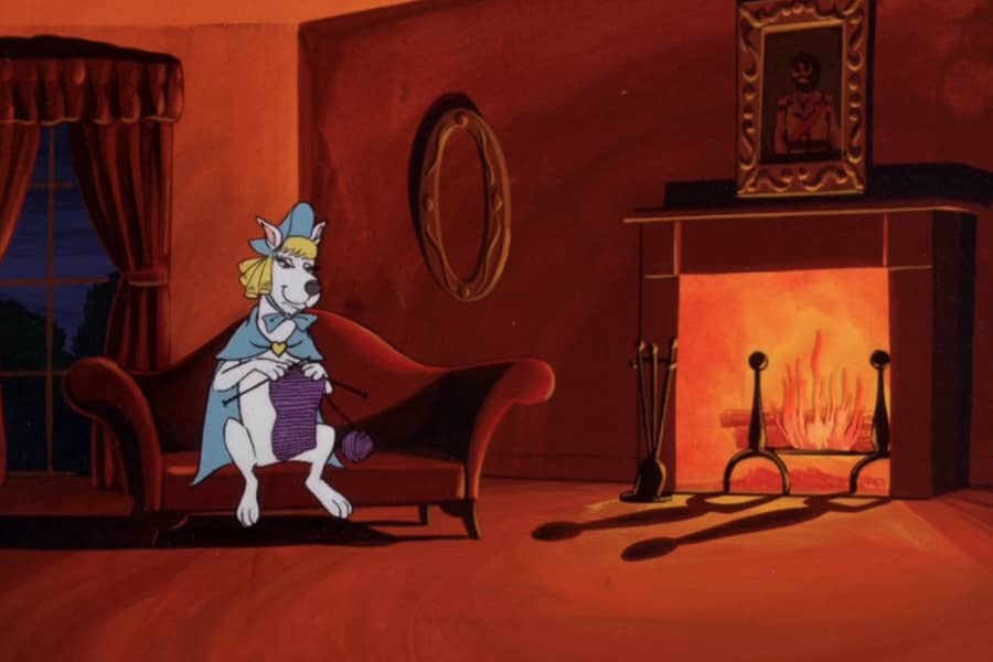 Scooby Dee as Mary Jane, knitting on the couch by the fire
