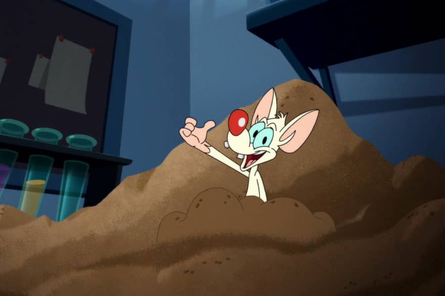 Pinky sinking in quicksand and giving a thumbs up