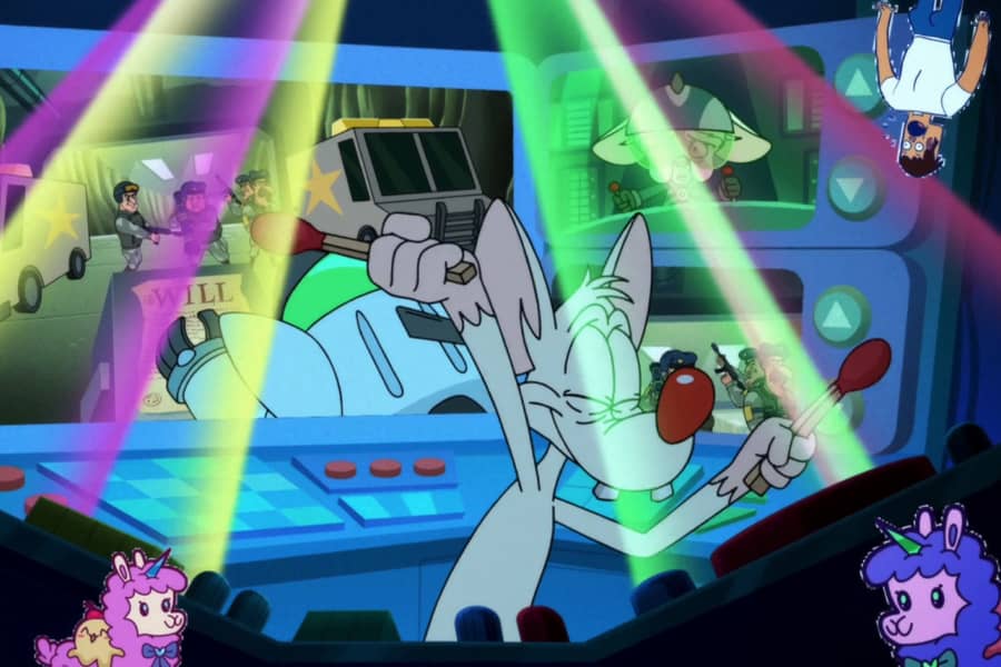 Pinky drumming with matchsticks while laser lights flash and cutout stickers adorn the screen