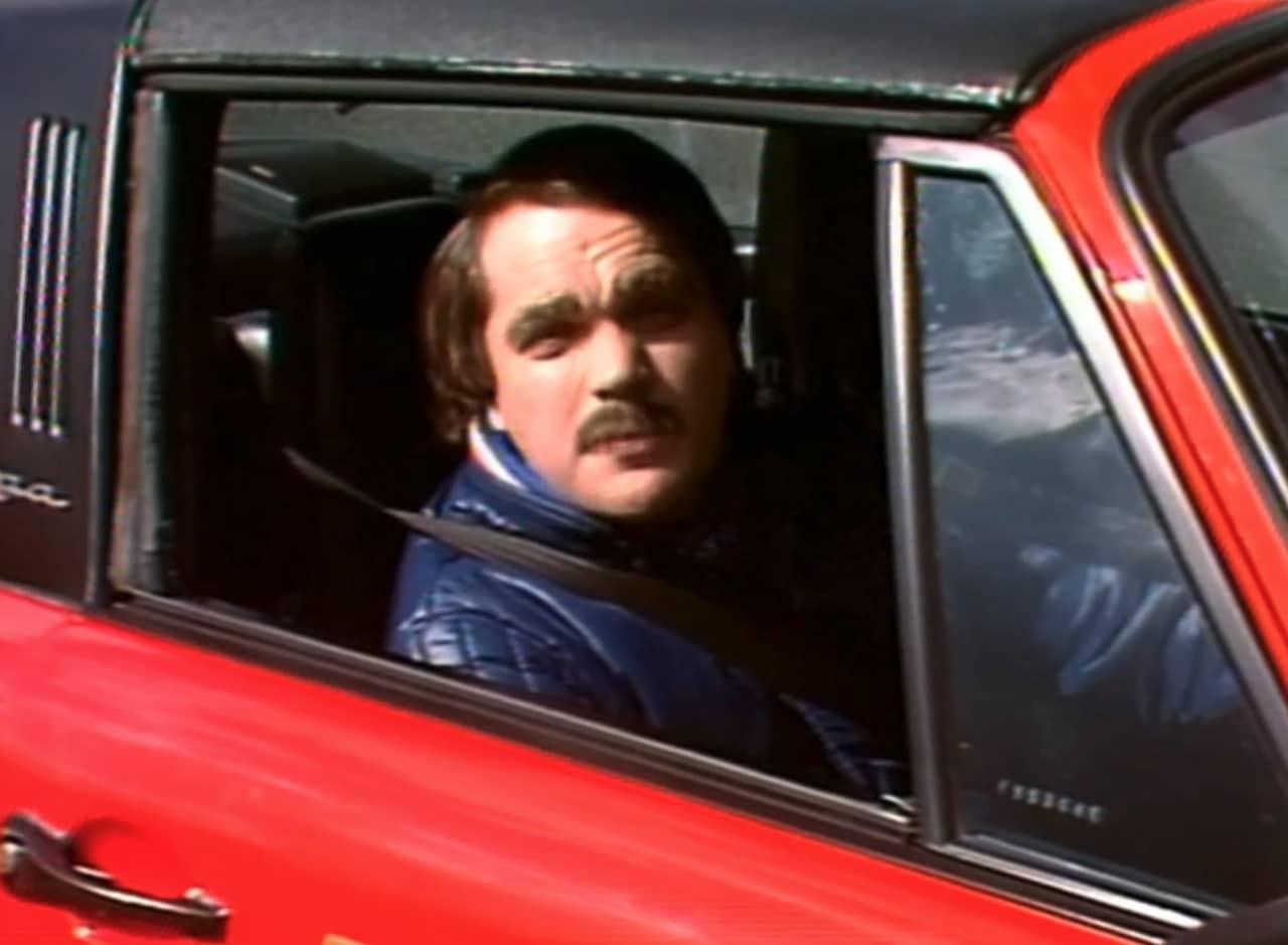 Steve Pising in the driving seat of his red car