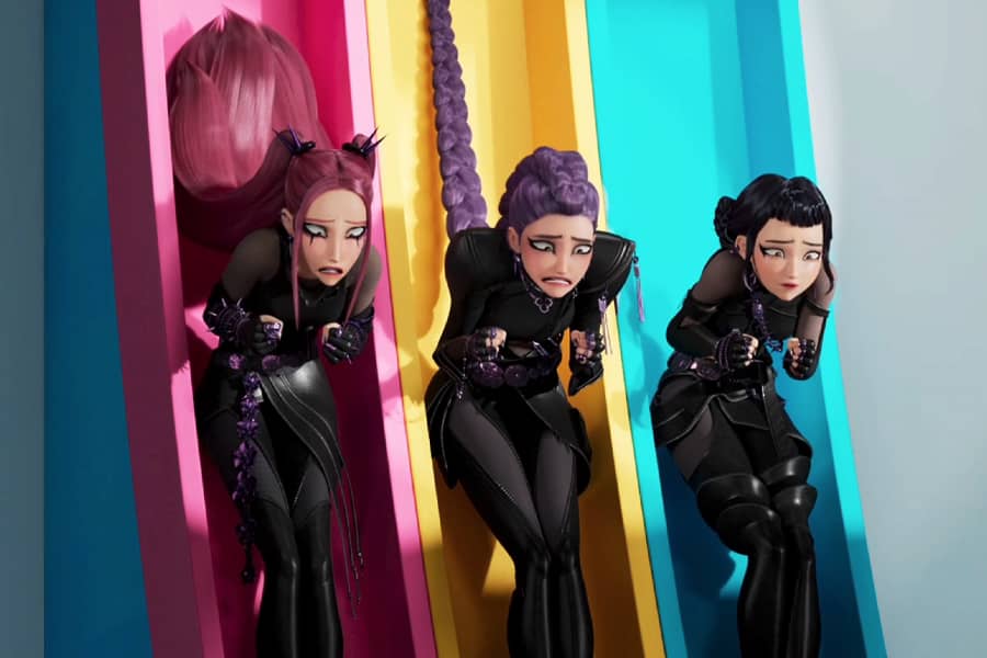 Huntrix sticking to the slides in their leather clothes