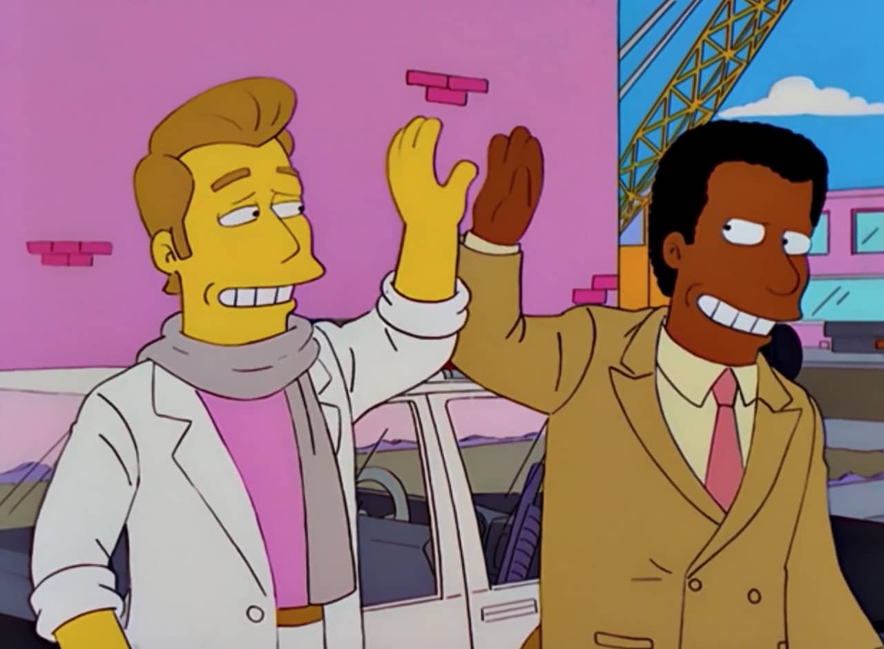 two detectives, Simpson and Kaufman, high five