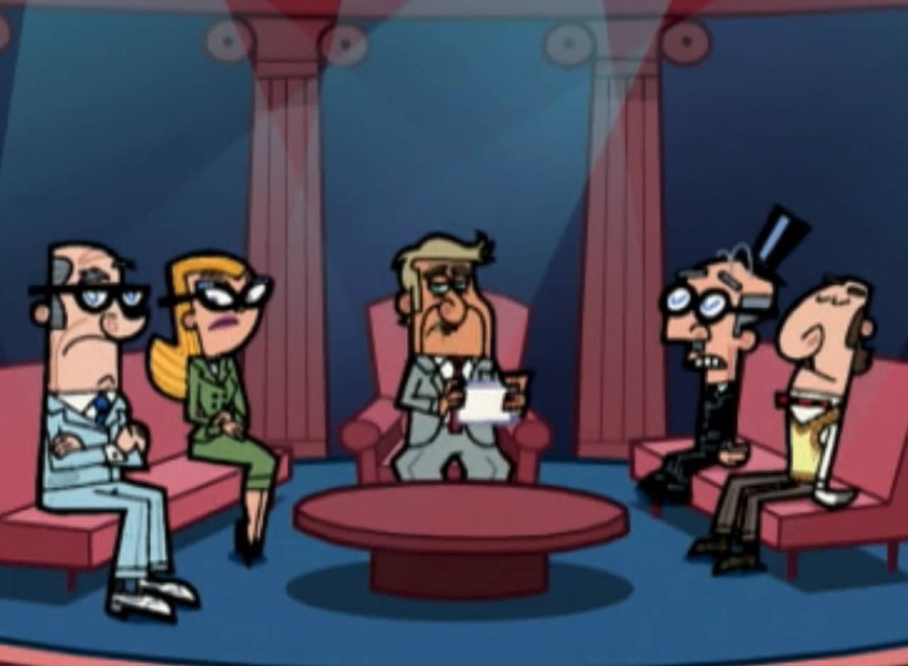 a tv studio stage with a host and four guests on couches