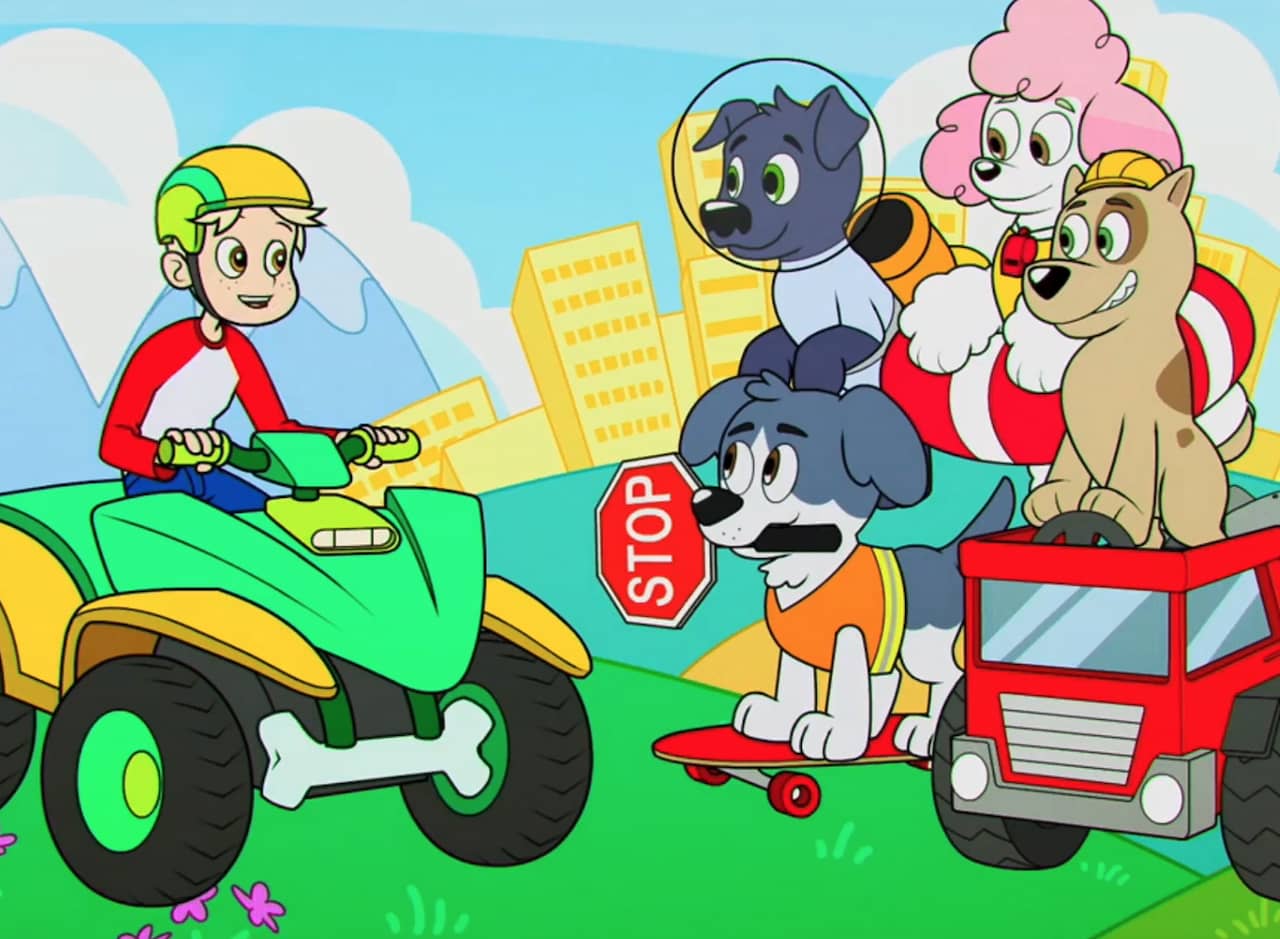 The Pooch Pack, four dogs using various modes of transport, with a kid on an ATV