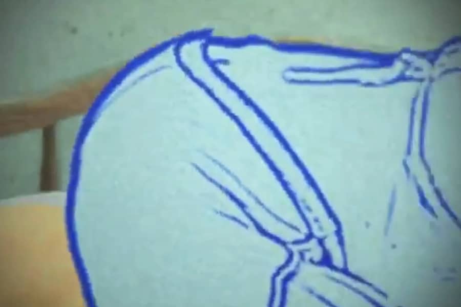 Tom’s backside, still wearing shorts