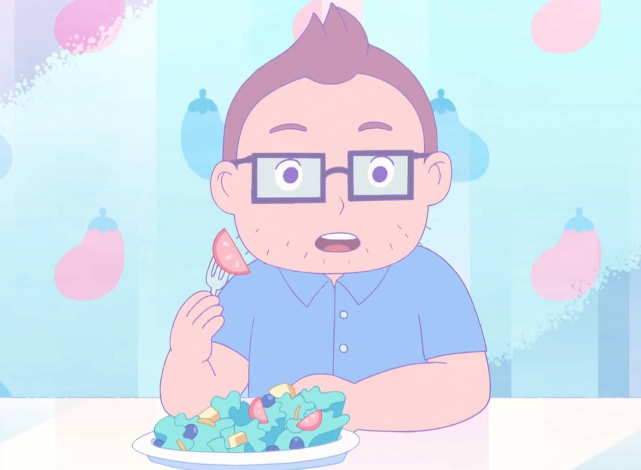 man with glasses eats a salad