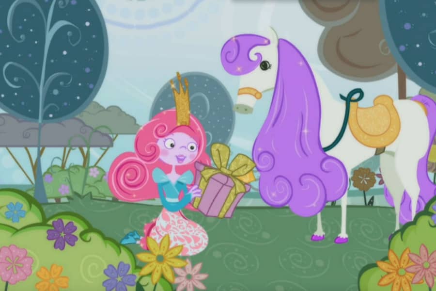Princess and Penelope Pony in the grass opening a present