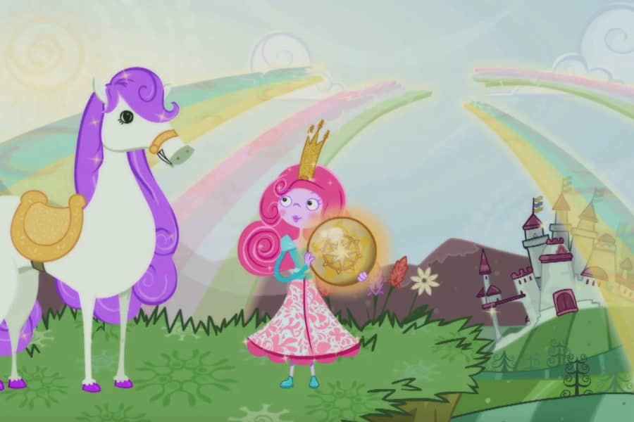 Penelope Pony with Princess who has a big gold compass; a rainbow shines on the castle