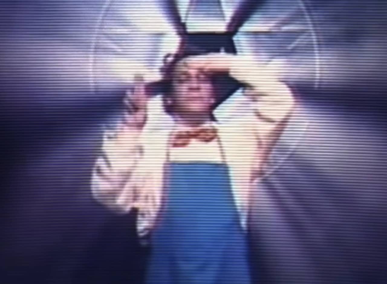 the Psychic Cook, in a bowtie and apron