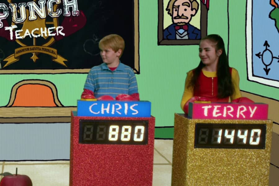 two kids, Chris and Terry, in front of game show podiums