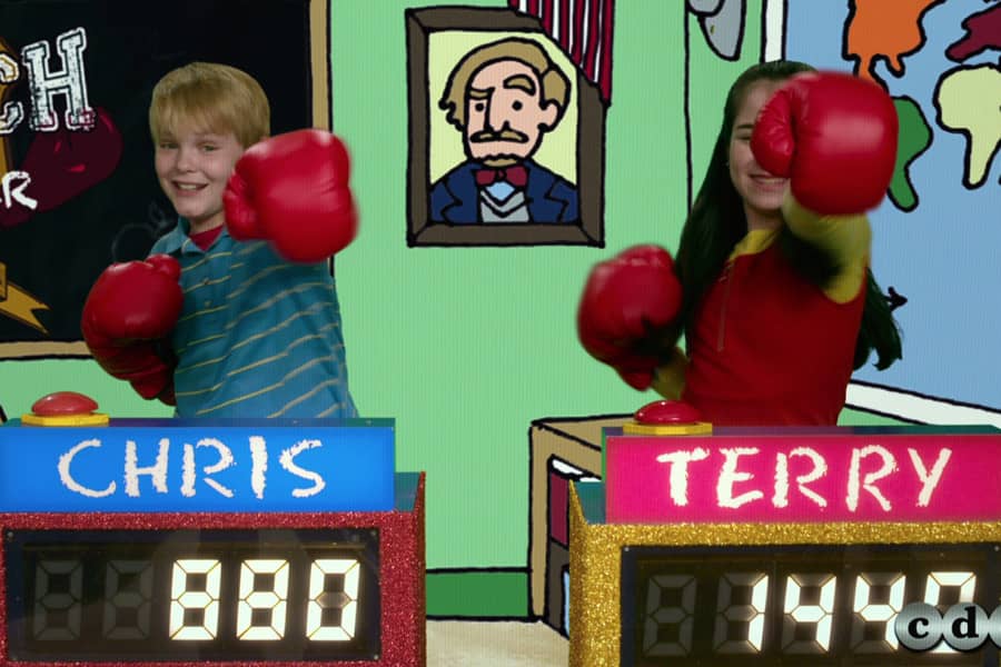 two kids, Chris and Terry, punching the air with boxing gloves