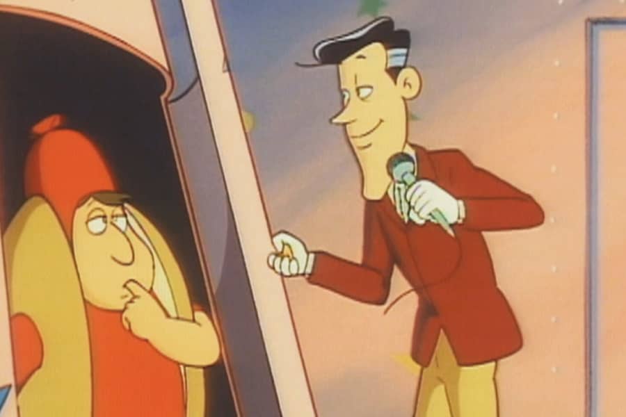 host with a contestant in a hot dog costume