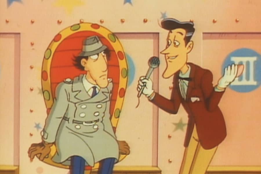 Inspector Gadget sits in a chair and talks with the host
