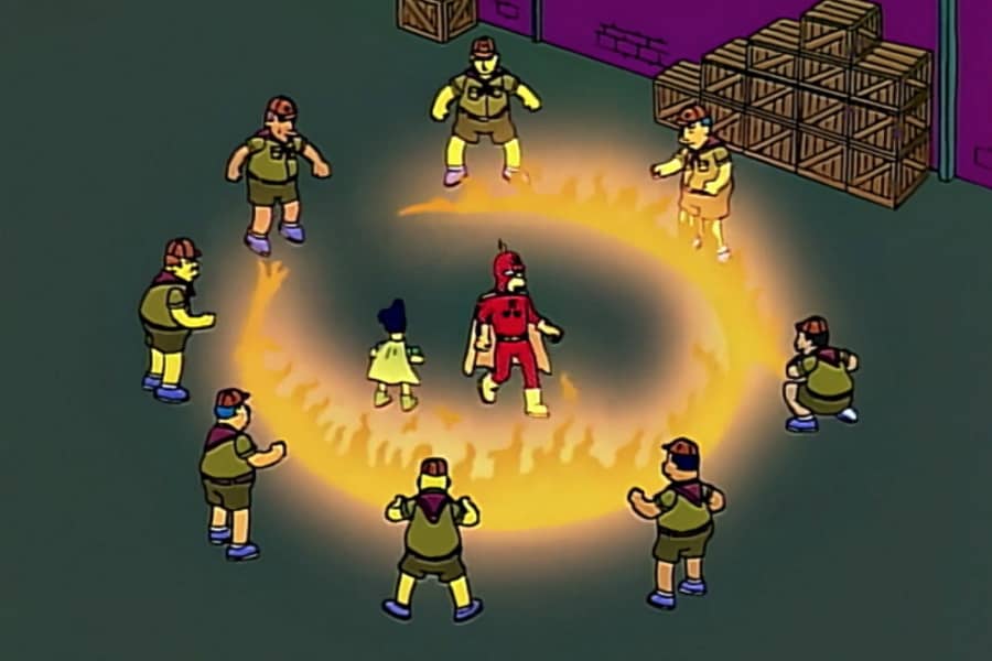 boy scouts create a circle of fire around Radioactive Man and Fallout Boy