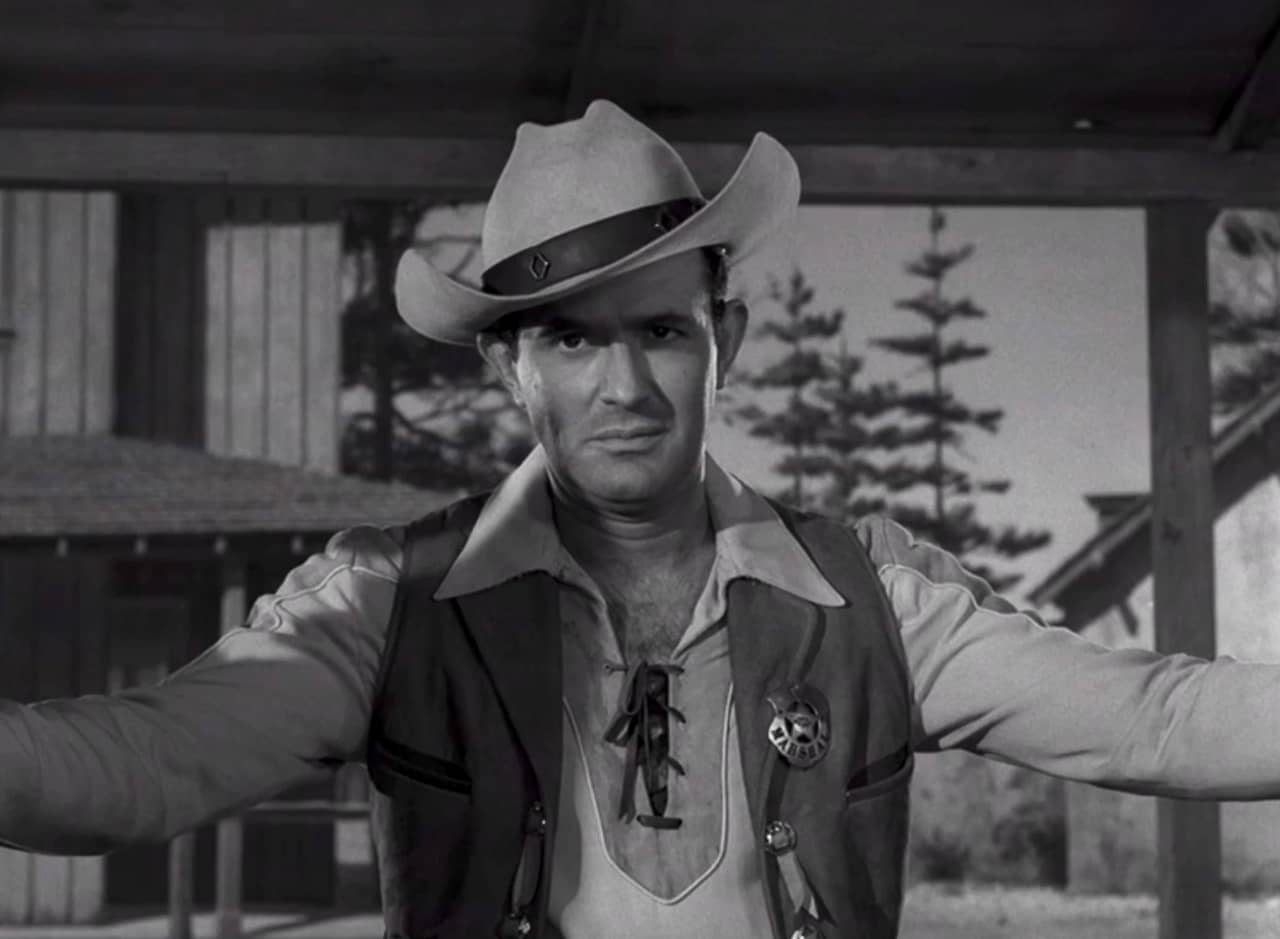 Rance McGrew as a U.S. Marshal, entering a saloon