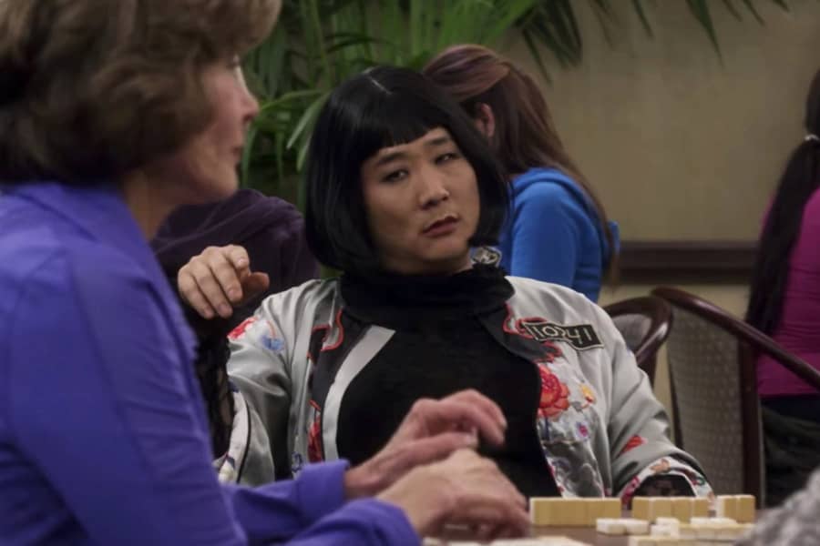 Mrs. Oh glares at Lucille Bluth at the mahjong table