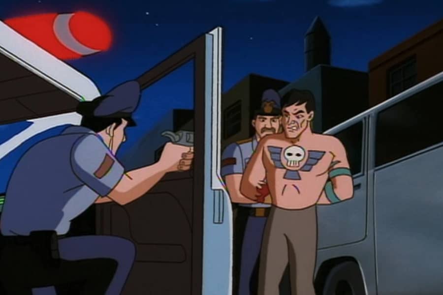 cops apprehending a shirtless suspect