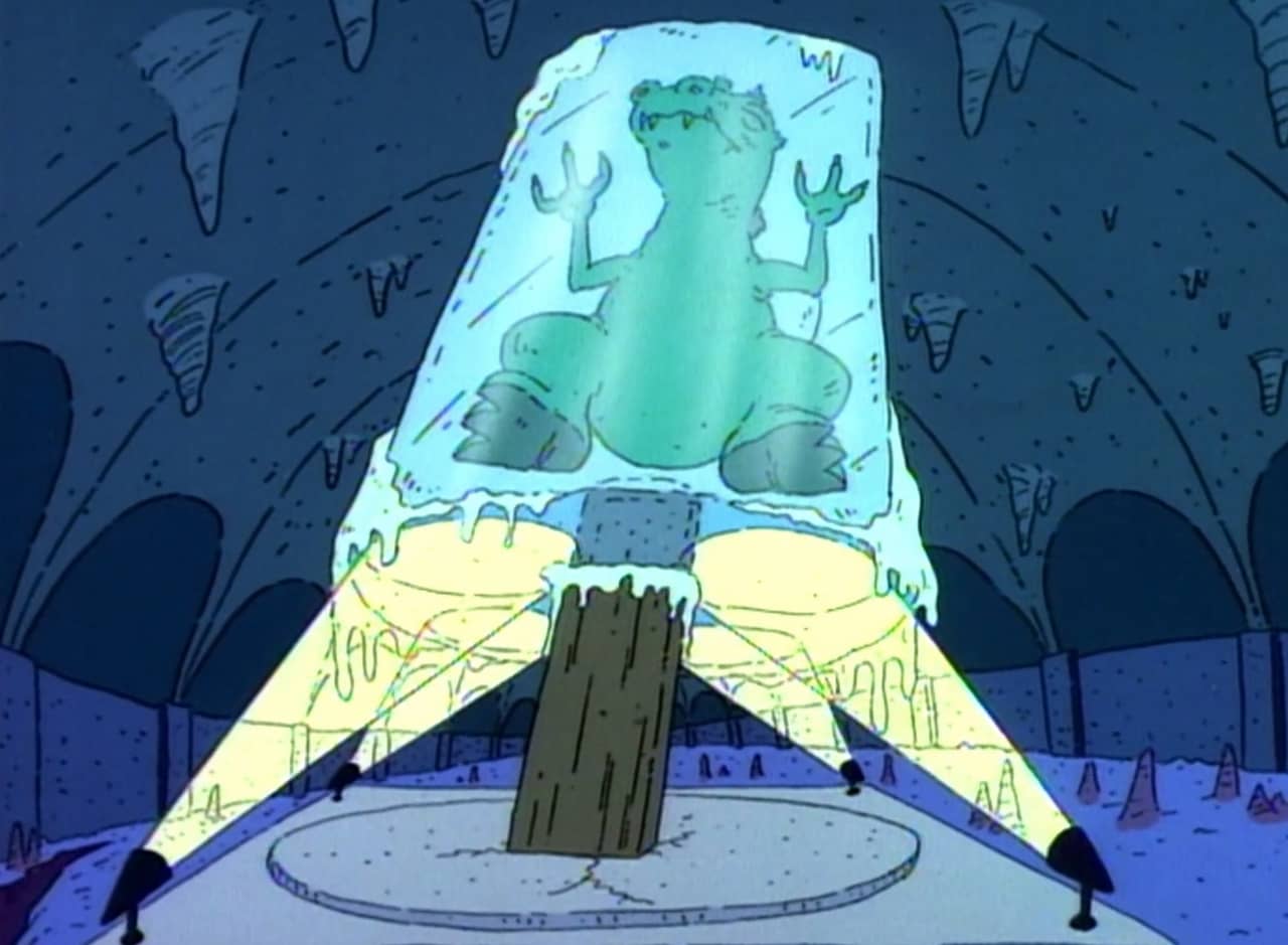 Reptar, a giant t-rex, encased in a huge ice pillar