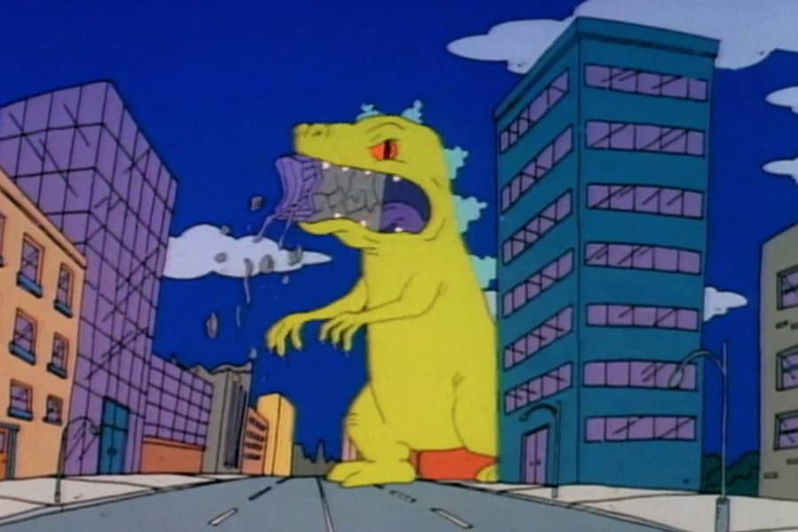 Reptar chomps on a chunk of building