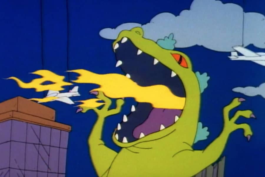 Reptar breathes fire at an airplane