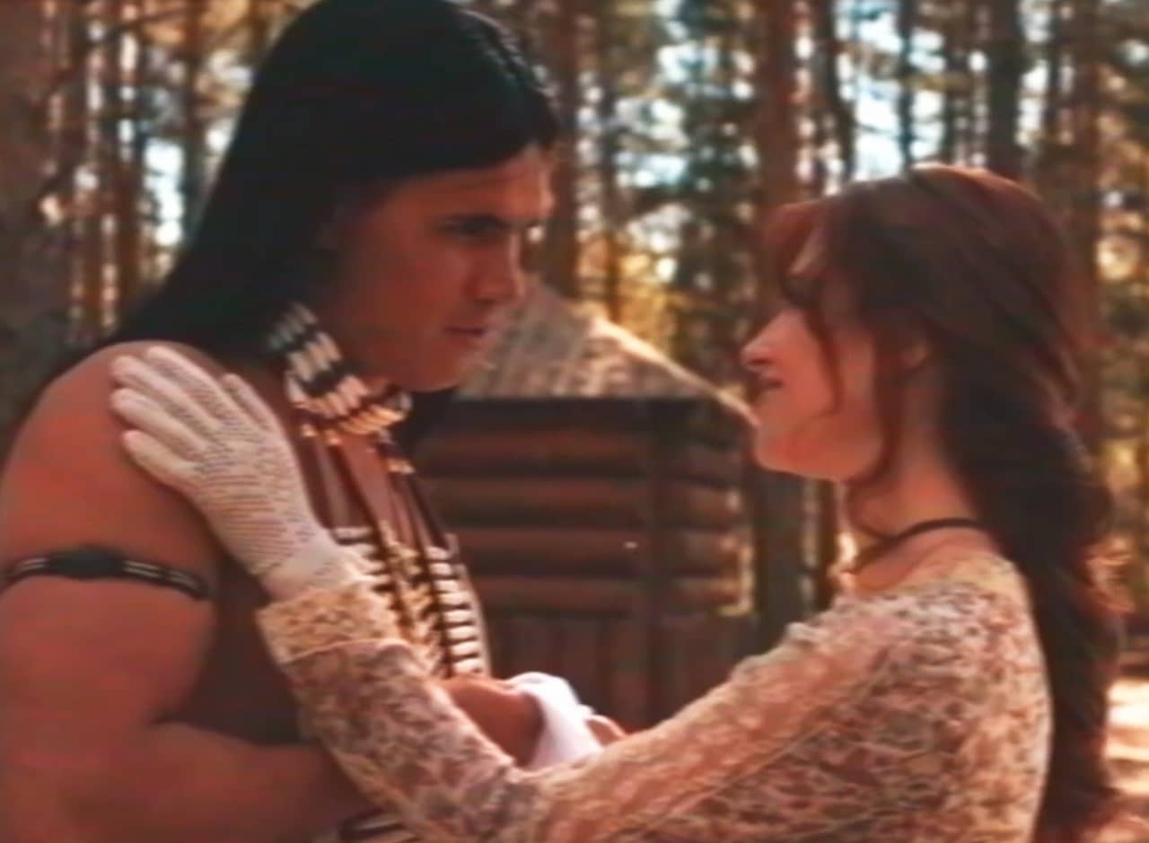 white settler woman embraces Tatanka, a Native American man