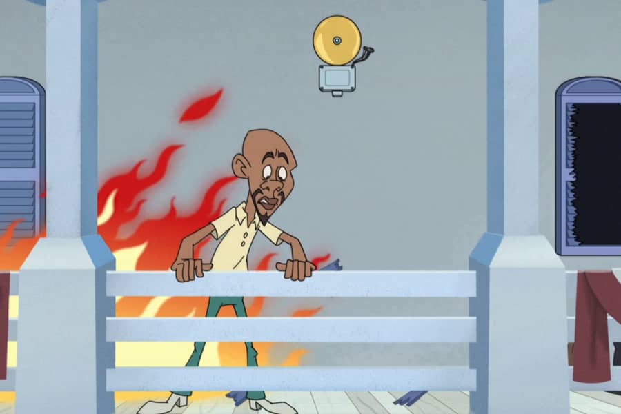 man looking over the boat railing as a fire grows behind him