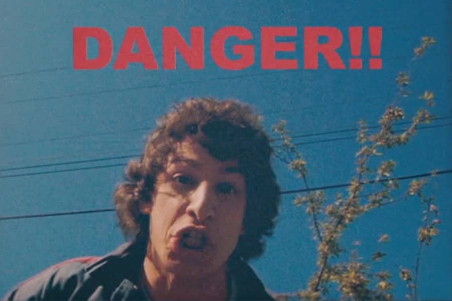 Rod gritting teeth at the camera with “Danger!!” text above