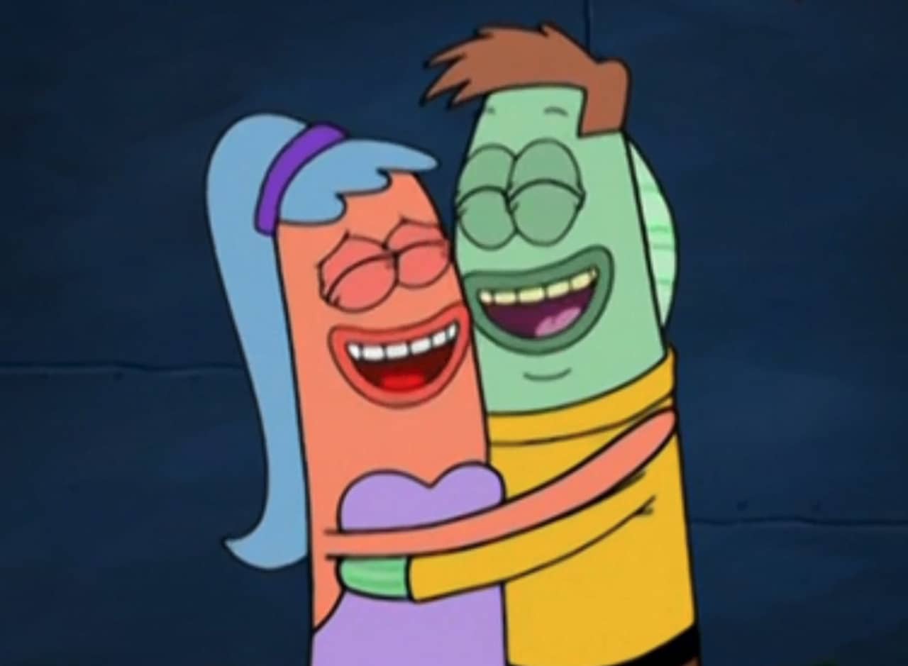 two fish embracing and laughing