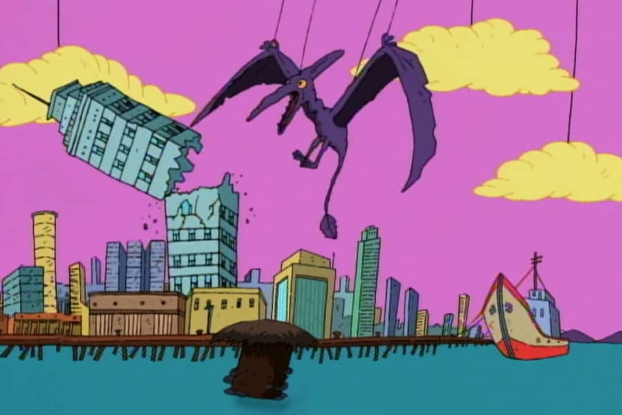 Dactar the pterodactyl on strings knocks a building over