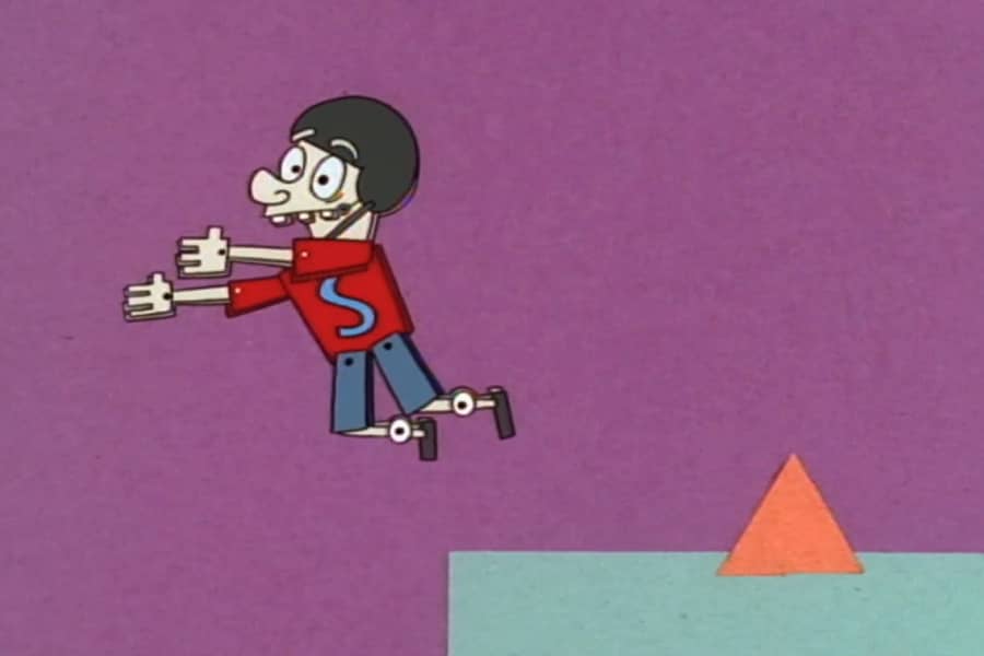 Safety Sammy jumping over a small pyramid and off a ledge