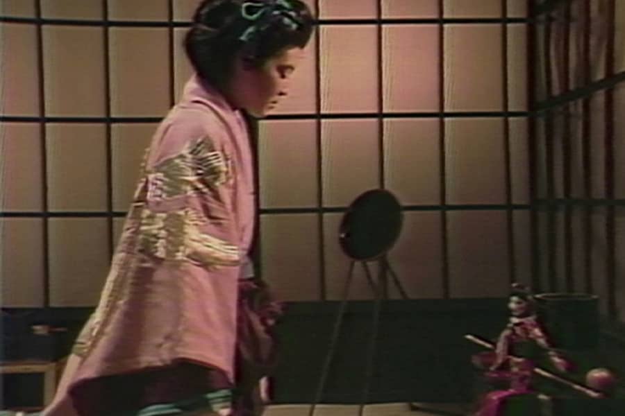 geisha prepares for a visit from the samurai