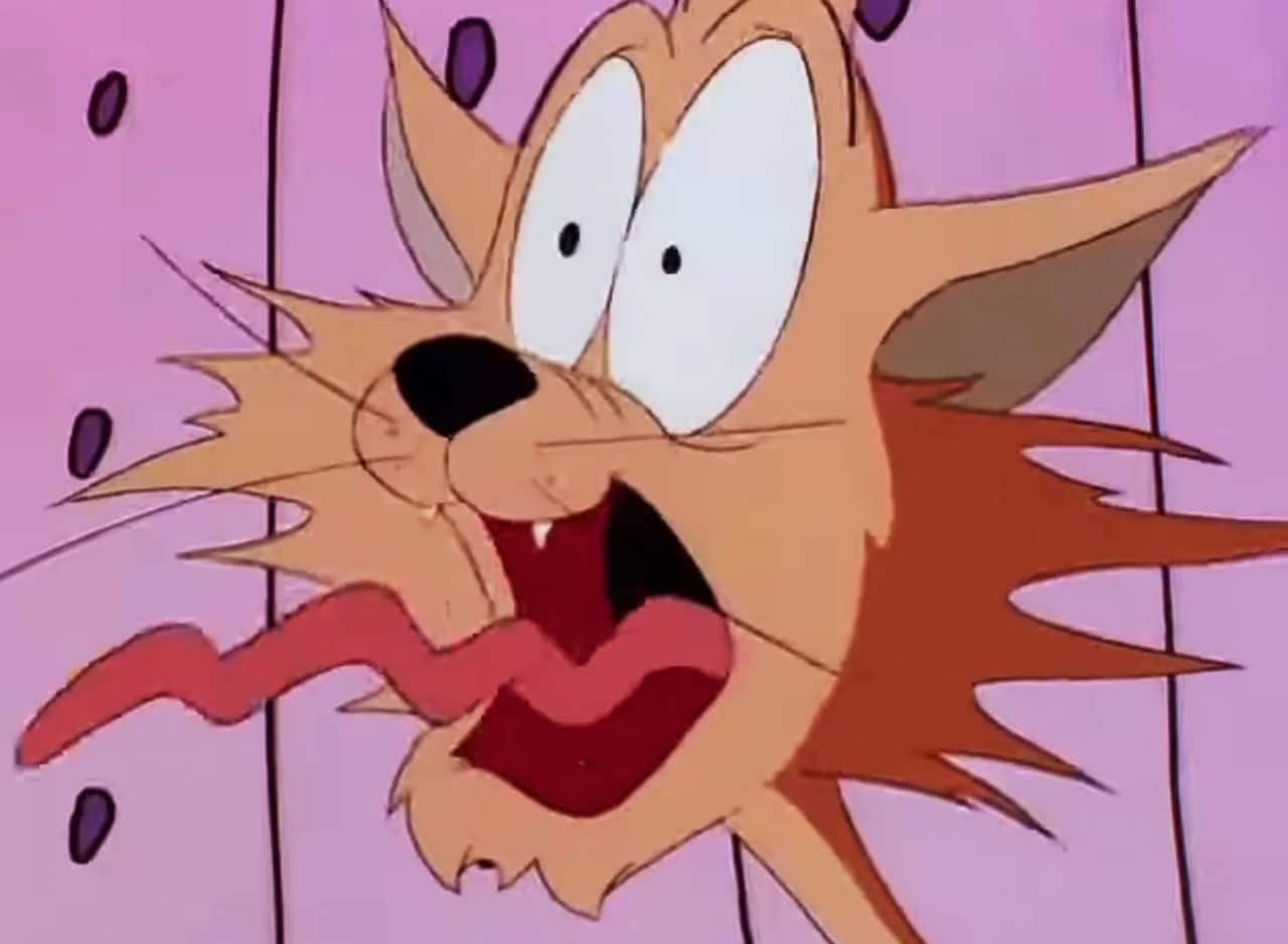 Scaredy-Kat, an orange cat, screaming with his eyes bulging and tongue sticking out