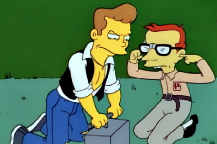 Corey detonates a bomb while Nerdlinger plugs his ears