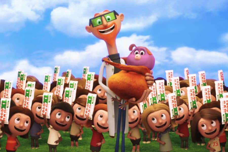 Chester V with a bunch of kids holding Food Bars and he is holding Barb, his orangutan