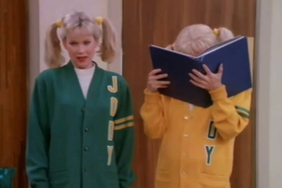 Jody and Judy, who has her face covered with a big book